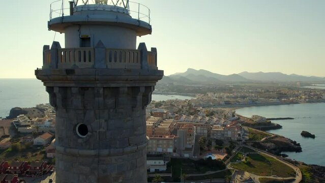 Aerial shot, drone point of view Cabo de Palos lighthouse of La Manga del Mar Menor in seaside spit of Mar Menor in the Region of Mursia, Spain