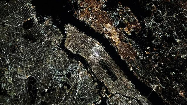 Flying over city of New York, United States, night lights aerial satellite view from space animation based on image by Nasa