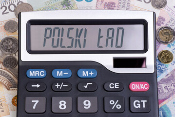 New tax law in Poland called Polski Ład, text Polski Lad displayed on a calculator on Polish currency background