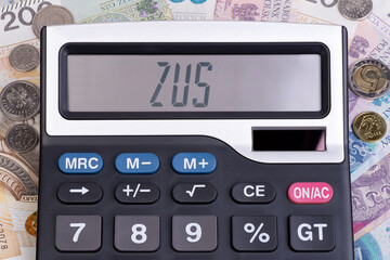Word ZUS written on a digital display on a calculator, ZUS is a social security system in Poland - obrazy, fototapety, plakaty