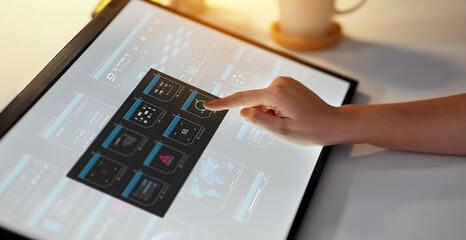 technology and people concept - hand working with virtual data on led light tablet or touch screen...