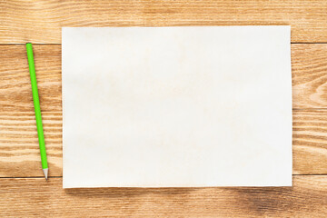 Sheet of paper lying on wooden table