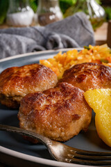 Meatballs  served with fired potatoes.