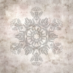 stylish textured old paper background with kaleidoscope snowflake