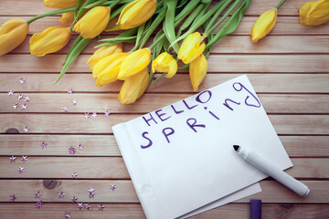 yellow tulips with inscription 