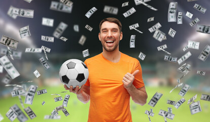 sport, leisure games and online betting concept - happy smiling man or football fan with soccer ball over money and stadium background