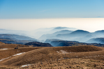 Winter landscape of the Lessinia plateau (Altopiano della Lessinia) and the Padana Plain or Po...