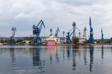 Port cranes and ships, summer view of Varna harbour