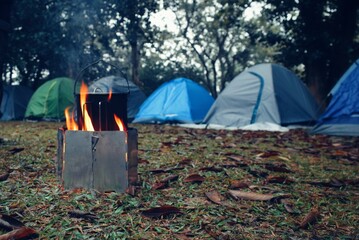 Outdoors cooking, cooking on camping , cooking in front of tent, making tea in the forest camping and tenting.