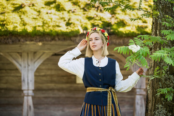 Latvian woman in traditional clothing. Ligo folk.