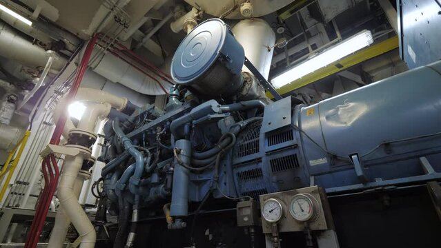 Fire sensor above diesel generator in engine room of ship