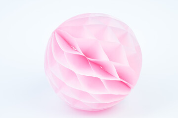 pink honeycomb pom-pom paper ball decoration isolated over the white background.