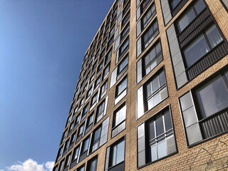 Fototapeta na wymiar Modern real estate, residential apartment building with panoramic windows