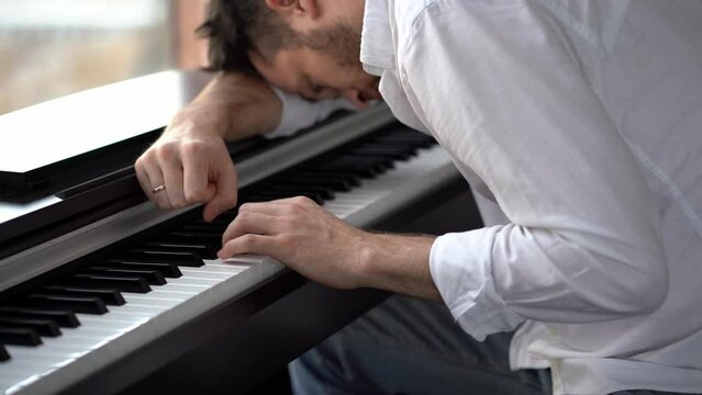 The pianist is a composer who has been abandoned by his muse in depression and plays the piano and cannot find inspiration.