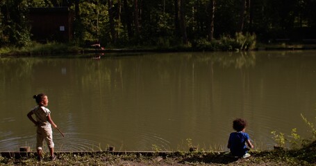 Obraz premium Outdoor play is an activity where children show their remarkable ability for exploration, imagination and decision making. Pond drowning incidents are particularly prevalent in kids under age of six.