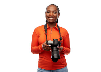 people, profession and photography concept - happy young woman with digital camera over white...