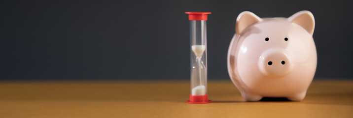 hourglass with pink piggy bank