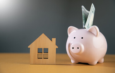 house model with piggy bank and house model