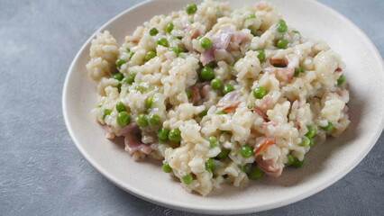 Classic italian risotto with peas, cheese parmesan, prosciutto. Risi e Bisi (Venetian-style rice and peas)