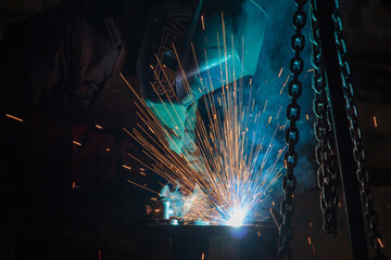 Sparks during metal processing and joining parts by welding