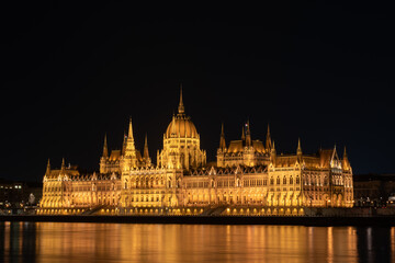 Fototapeta na wymiar Hungarian parliament building from across the Danube river at night Budapest Hungary Europe