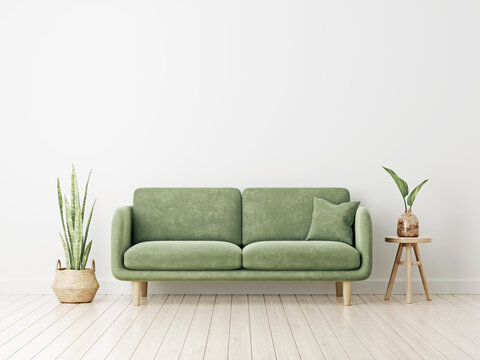 Empty living room wall mockup with green velvet sofa, pillow, snake plant in basket and leaves in wooden vase on blank white interior background. Illustration, 3d rendering