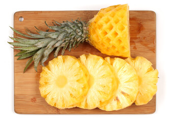 Ripe pineapple peeled on white background