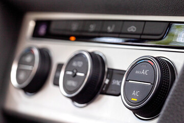 Modern car climate controls, macro. Modern climate control regulators in the car. Beautiful interior, comfort