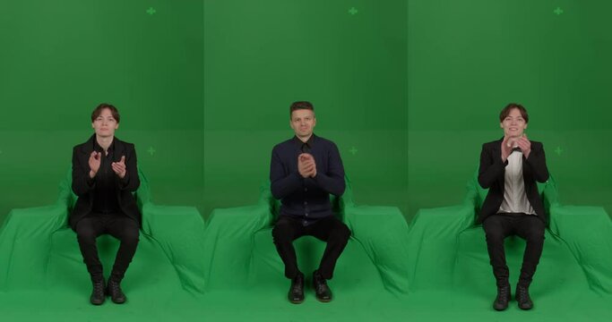 GREEN SCREEN CHROMA KEY Front view of spectators wearing formal attire applaud at their seats. Crowd replication for theater, opera, ballet. Unkeyed chairs to keep shadows
