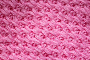 Handmade Knitted Pink Warm Sweater, macro. Background