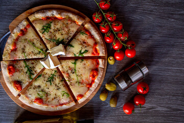 Pizza with Cheese tomatos mozzarela and olives. Photo for menu