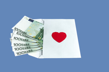 Paper envelope with 100 euro banknotes and a red heart on a blue background. Conceptual gift for Valentine's Day, wedding, birthday.