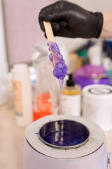 close-up. melted lilac wax for depilation and epilation