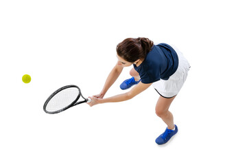 Obraz na płótnie Canvas Aerial view of young beautiful girl, tennis player in sportswear playing tennis isolated on white background. Beauty, sport concept.