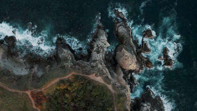 Aerial top down shot of path on mountaintop of Punta Cometa Viewpoint the most Southwestern Point in Mexico