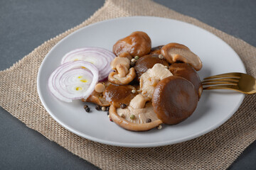 Milk mushroom salted on a plate