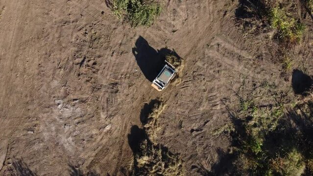 aerial view of small tractor prepare construction site to build house