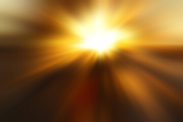 Abstract blurred golden background with a  flash and diverging rays in the middle