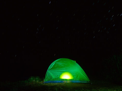 Startails with lighting in tent at natural park.