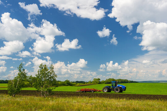 Tractor with plow at the edge of the field