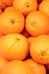 Orange fruit. Vertical view of few fresh juicy oranges. Close-up