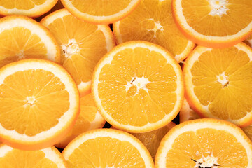 Orange fruit. Close-up shot of a lot of fresh sliced oranges