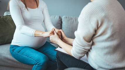 Pregnant woman on home counselling meeting. You're not in this alone. Depressed pregnant woman...