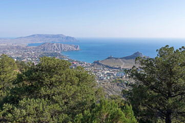 Fototapeta na wymiar View of the small resort town from the slope of the mountain. Crimea