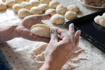  Woman cooking pies at home. Cooking and baking at home.