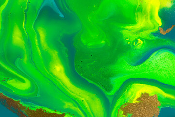 Fototapeta na wymiar Gold spots on flow green paints background. Abstract green print