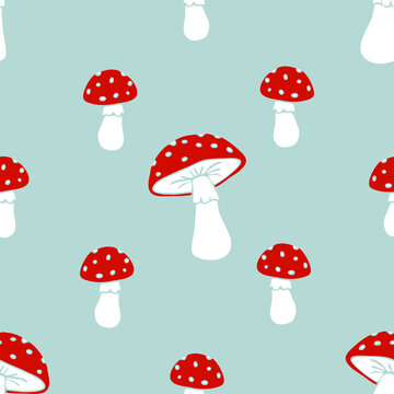 Seamless vector pattern with hand drawn toadstool on grey background. Simple cartoon mushroom wallpaper design. Decorative autumn fashion textile.