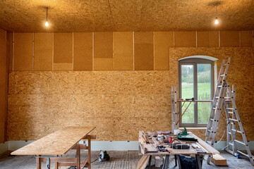 Installing thermal insulation inside a building, wood fiber boards and OSB