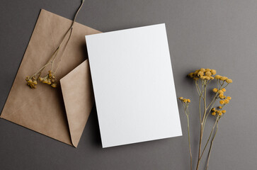 Wedding invitation or greeting card mockup with dry twigs and envelope © nikavera