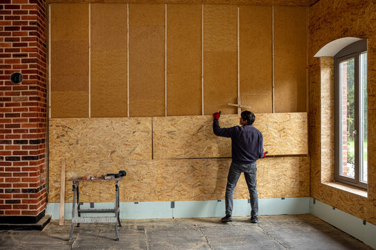 Installing thermal insulation inside a building, wood fiber boards and OSB